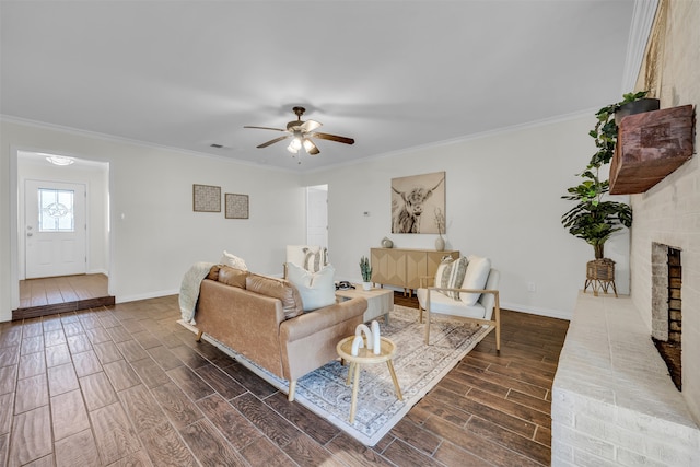 living room with a fireplace, dark hardwood / wood-style floors, ceiling fan, and crown molding