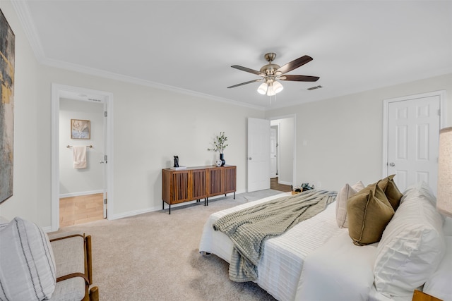 carpeted bedroom featuring connected bathroom, ceiling fan, and ornamental molding