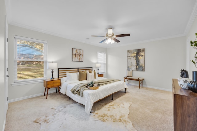 bedroom featuring ceiling fan, crown molding, and light carpet