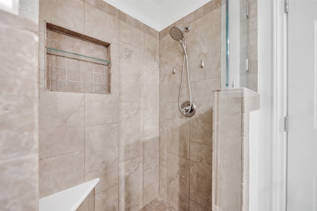 bathroom featuring tiled shower