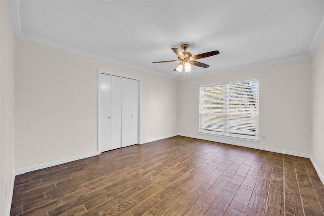 unfurnished bedroom with ceiling fan, crown molding, and dark wood-type flooring