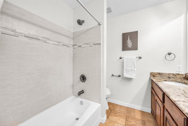 full bathroom featuring vanity, toilet, and tiled shower / bath