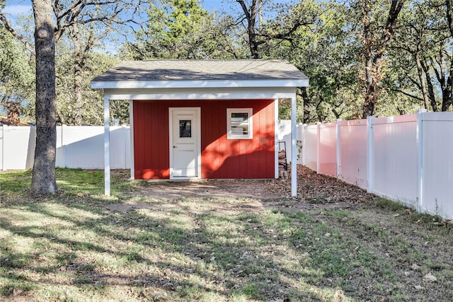 view of outbuilding featuring a lawn