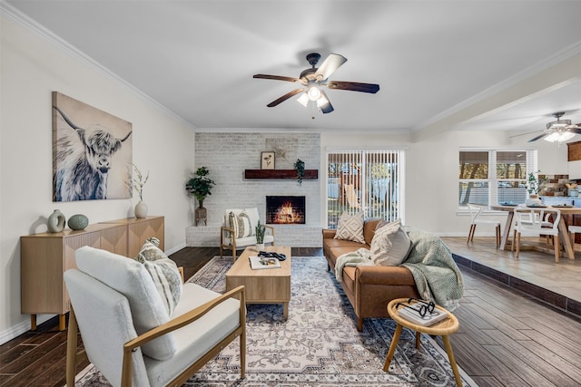 living room featuring a fireplace, dark hardwood / wood-style floors, ceiling fan, and ornamental molding