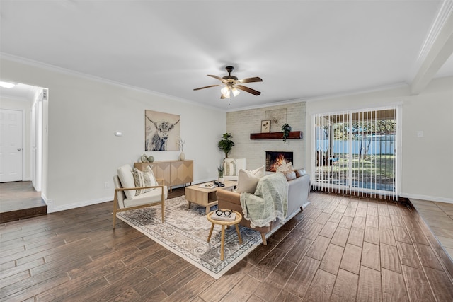 living room featuring dark hardwood / wood-style floors, ceiling fan, ornamental molding, and a brick fireplace