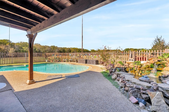 view of pool featuring a patio area