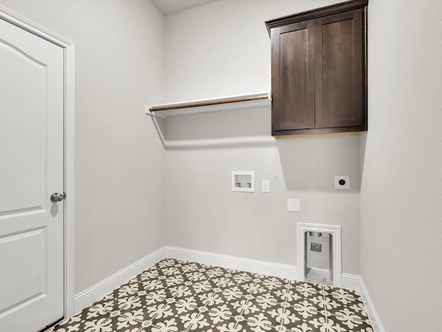 laundry room with electric dryer hookup, cabinets, and hookup for a washing machine