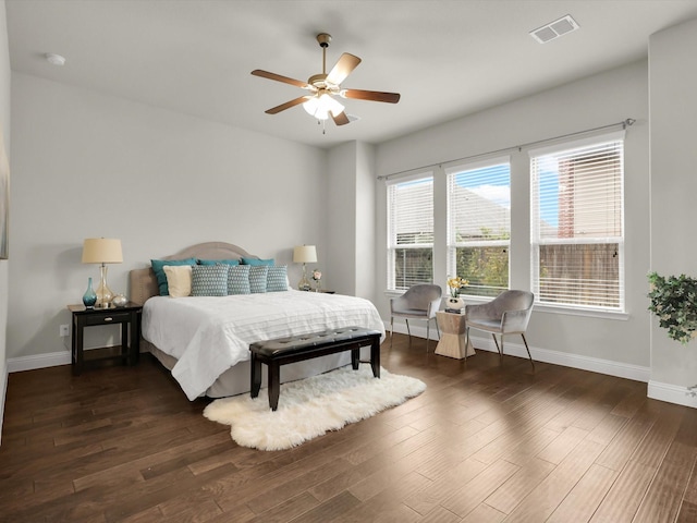 bedroom with ceiling fan and dark hardwood / wood-style floors