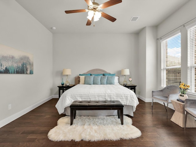 bedroom featuring ceiling fan and dark wood-type flooring