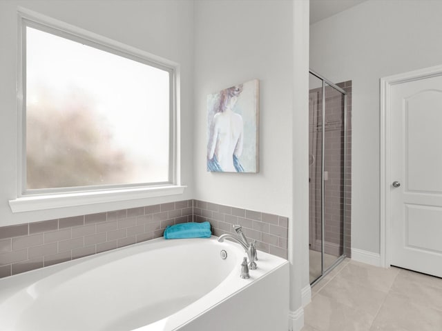 bathroom with shower with separate bathtub