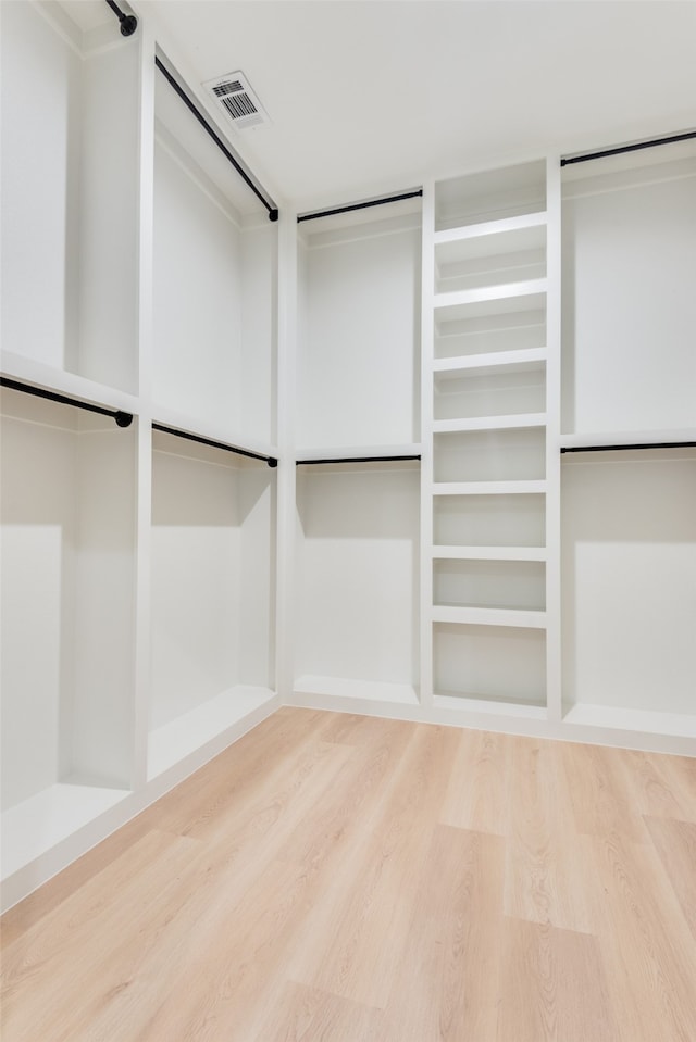 walk in closet featuring hardwood / wood-style floors