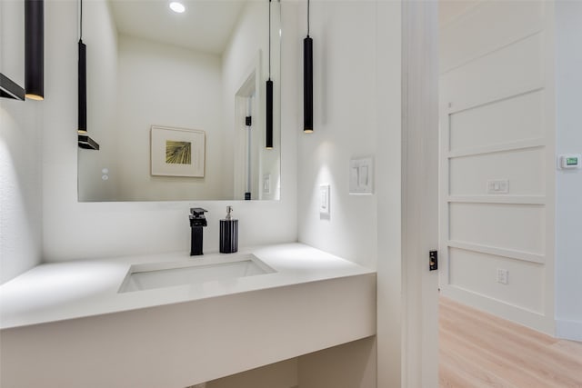 bathroom with vanity and wood-type flooring