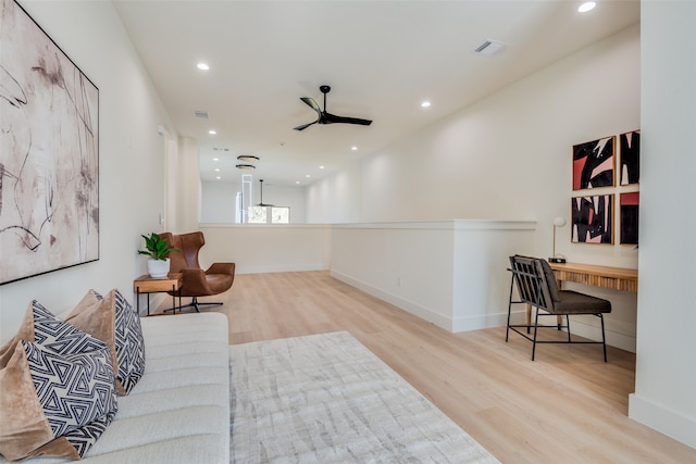 interior space with ceiling fan and light wood-type flooring