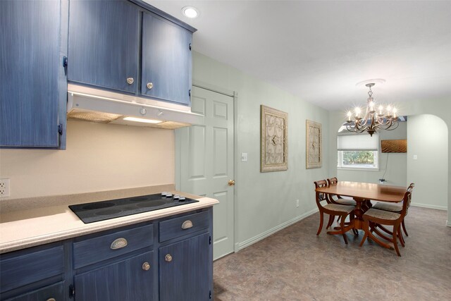 kitchen with blue cabinetry, a chandelier, hanging light fixtures, and black electric cooktop