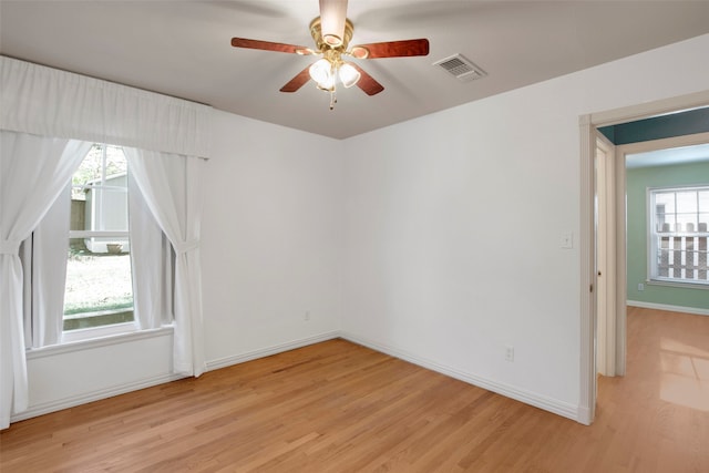 spare room featuring ceiling fan and light wood-type flooring