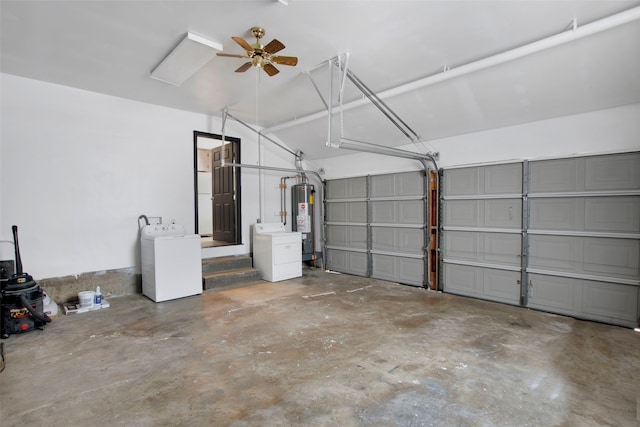 garage featuring washer and dryer, ceiling fan, and water heater