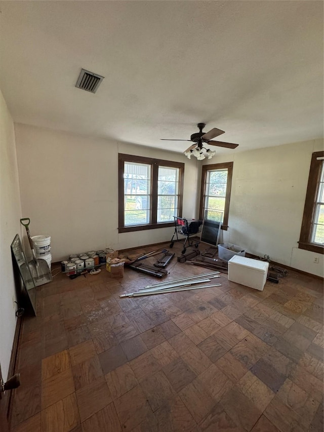 interior space featuring ceiling fan