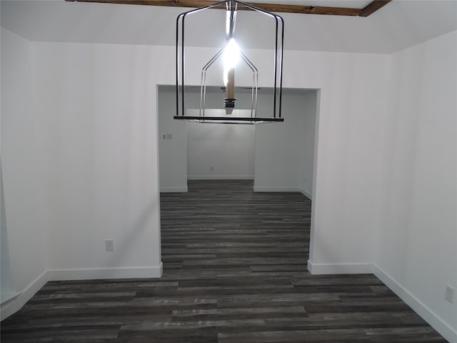 unfurnished dining area featuring dark wood-type flooring