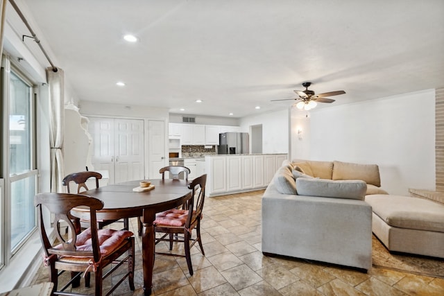 dining space featuring ceiling fan