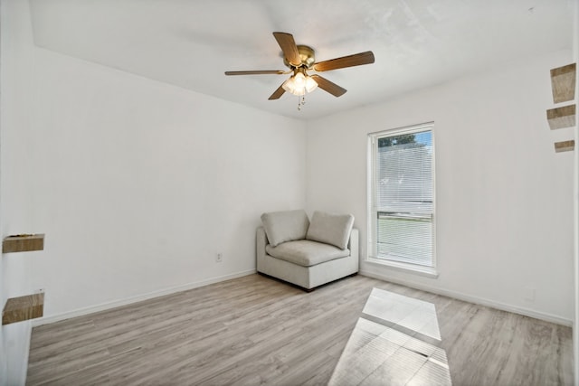 unfurnished room with ceiling fan and light hardwood / wood-style flooring