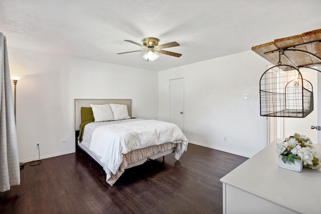 bedroom with ceiling fan and dark wood-type flooring