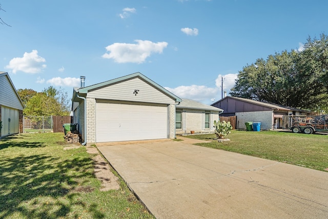 ranch-style home with brick siding, an attached garage, fence, driveway, and a front lawn