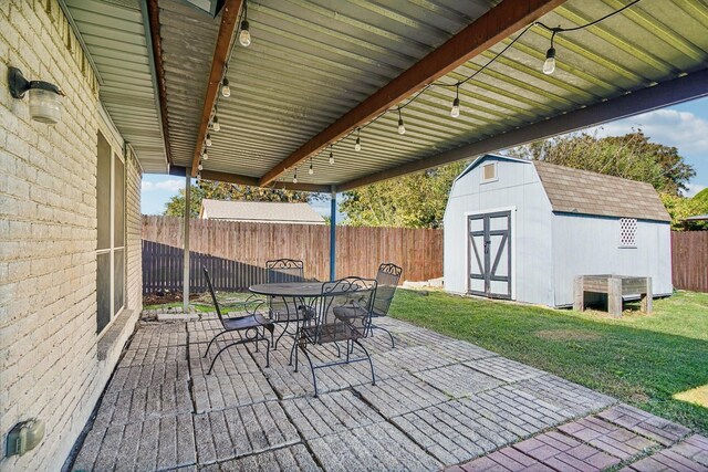 view of patio / terrace with a shed