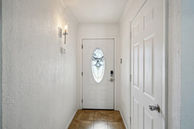 doorway featuring ornamental molding