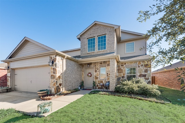 view of front of house featuring a garage and a front lawn