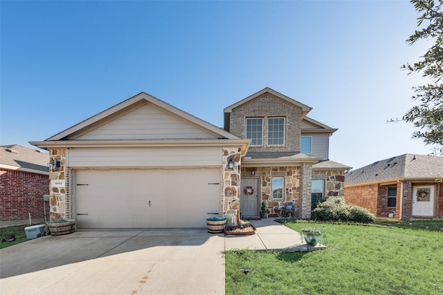 view of front facade featuring a front yard and a garage