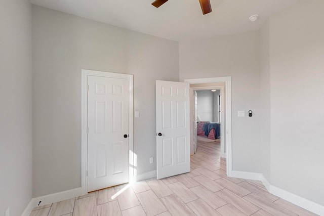 spare room featuring ceiling fan and light hardwood / wood-style floors