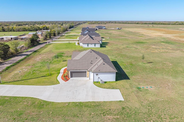 birds eye view of property with a rural view