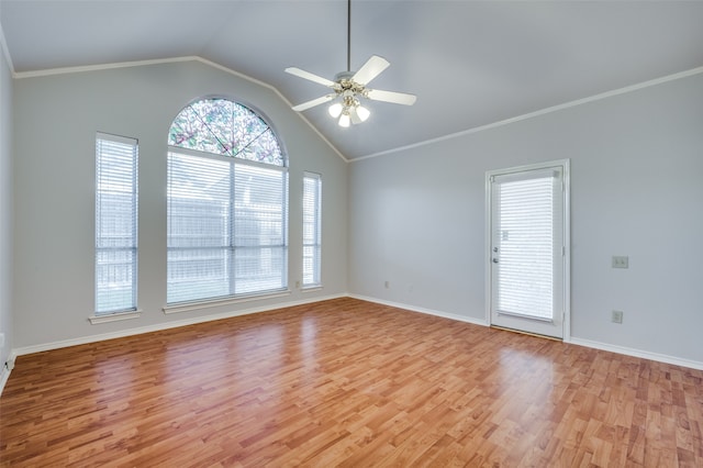 empty room featuring light wood-type flooring, vaulted ceiling, ceiling fan, and ornamental molding