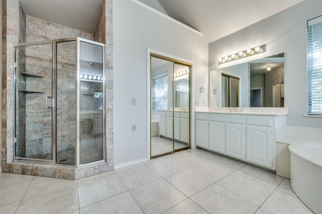 bathroom featuring tile patterned flooring, vanity, plus walk in shower, and vaulted ceiling