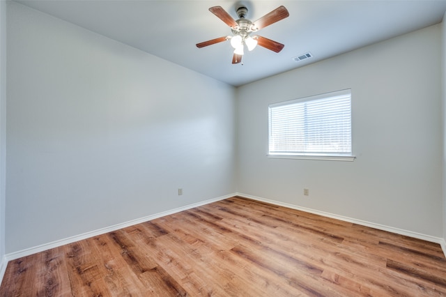 spare room featuring ceiling fan and light wood-type flooring