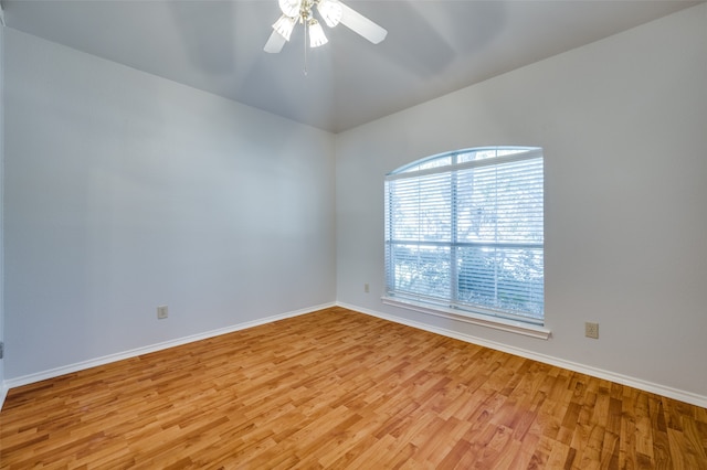 empty room with ceiling fan and light wood-type flooring