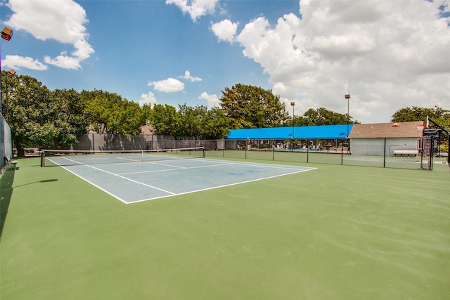 view of tennis court featuring basketball court