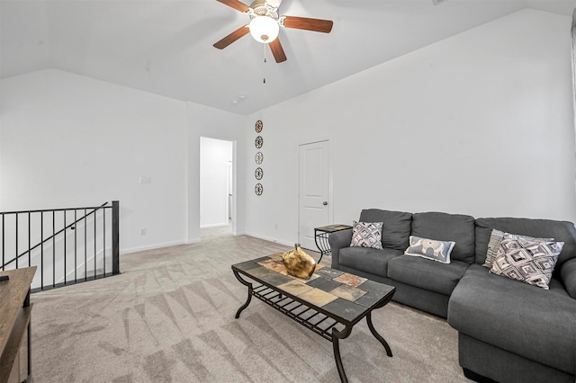 living room with ceiling fan, lofted ceiling, and light carpet