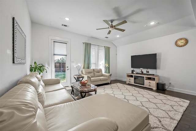 living room with ceiling fan, dark hardwood / wood-style flooring, and lofted ceiling