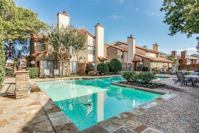 view of swimming pool with a patio