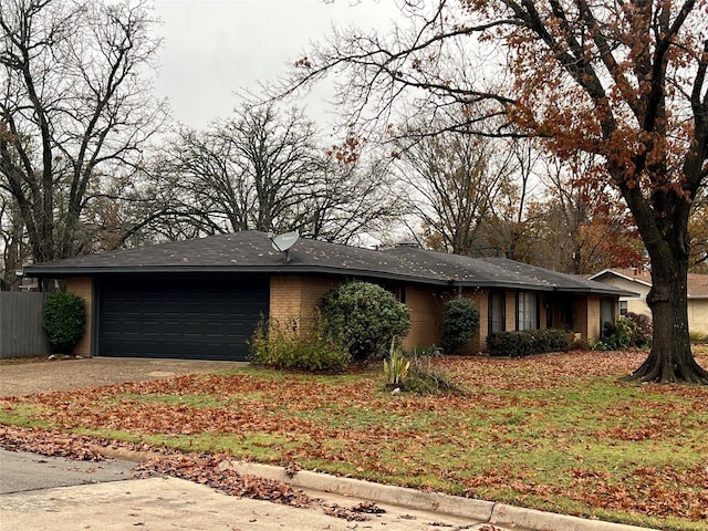 ranch-style home with a garage