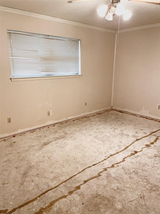 spare room featuring crown molding, ceiling fan, and a textured ceiling