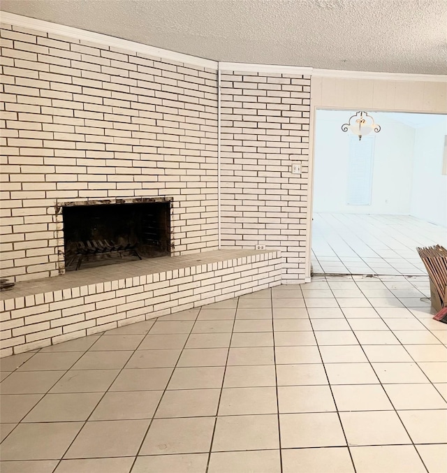 unfurnished living room featuring light tile patterned flooring, a textured ceiling, and a brick fireplace