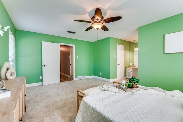 carpeted bedroom featuring ceiling fan