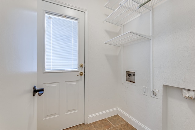 laundry area featuring tile patterned floors, washer hookup, and hookup for an electric dryer