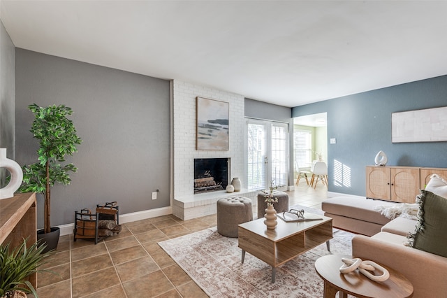 living room with tile patterned flooring and a brick fireplace