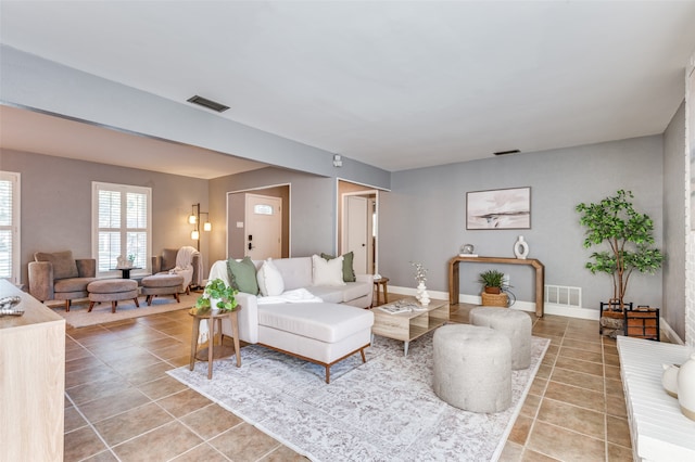 living room with tile patterned flooring