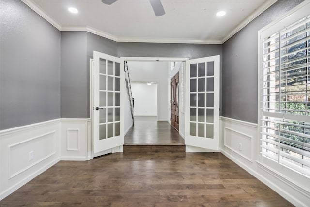 spare room featuring french doors, dark hardwood / wood-style floors, and ornamental molding