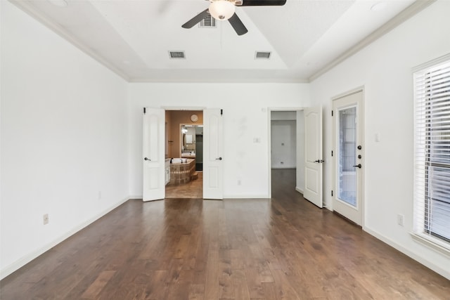 empty room featuring crown molding, dark hardwood / wood-style flooring, and ceiling fan