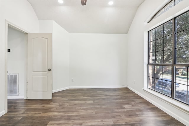 unfurnished room featuring ceiling fan, dark wood-type flooring, and vaulted ceiling